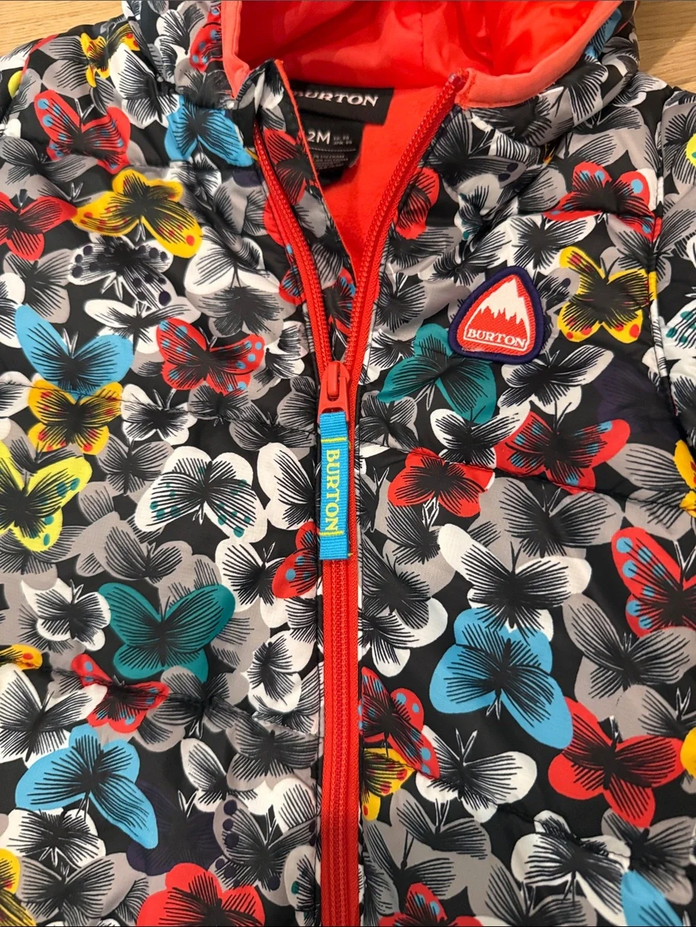 Burton Kids One-Piece Snowsuit with Multicolor Butterfly Pattern and Red Trim